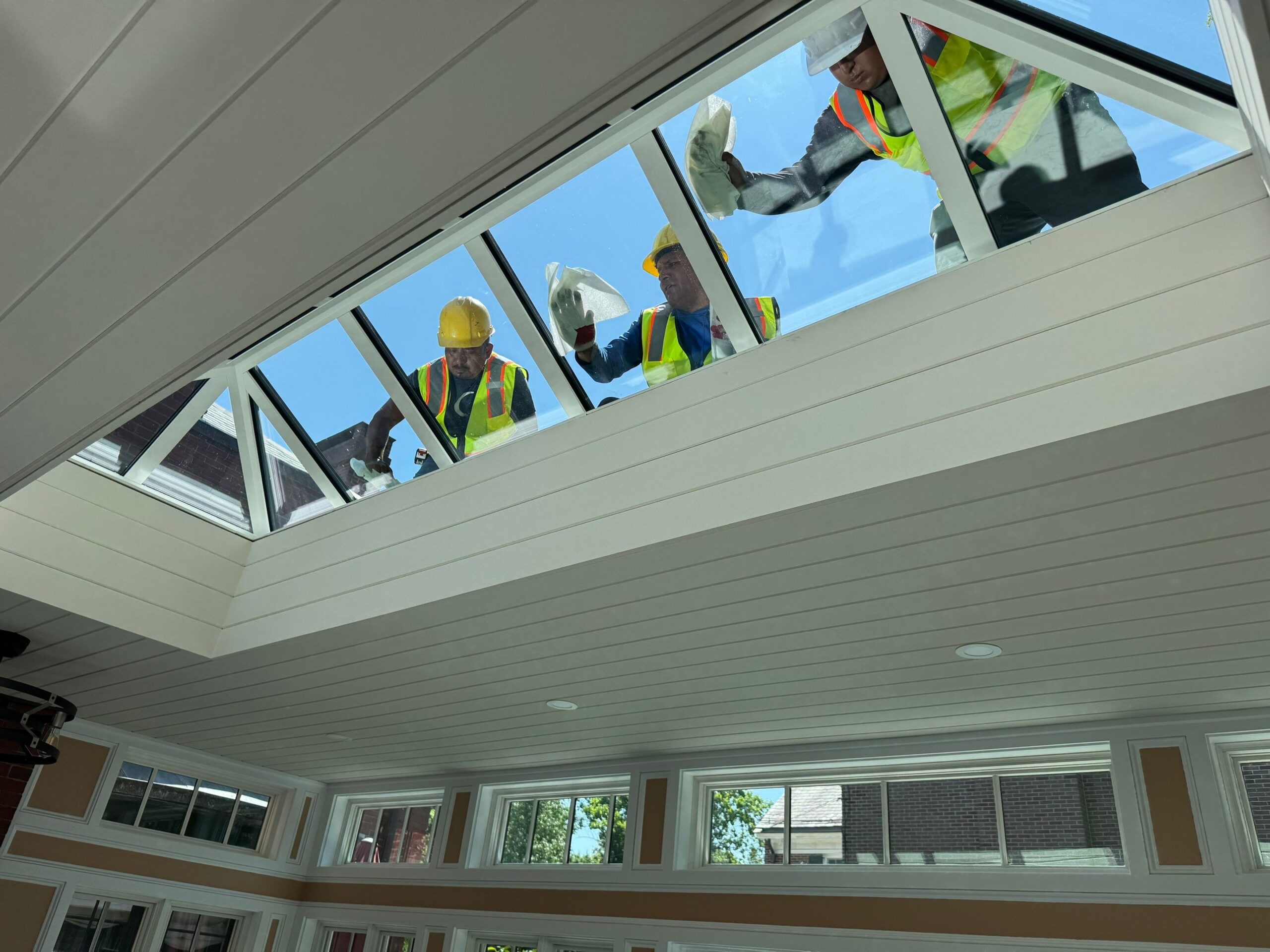 Interior view of a VELUX metal-framed commercial skylight delivering even daylight in a Rhode Island facility