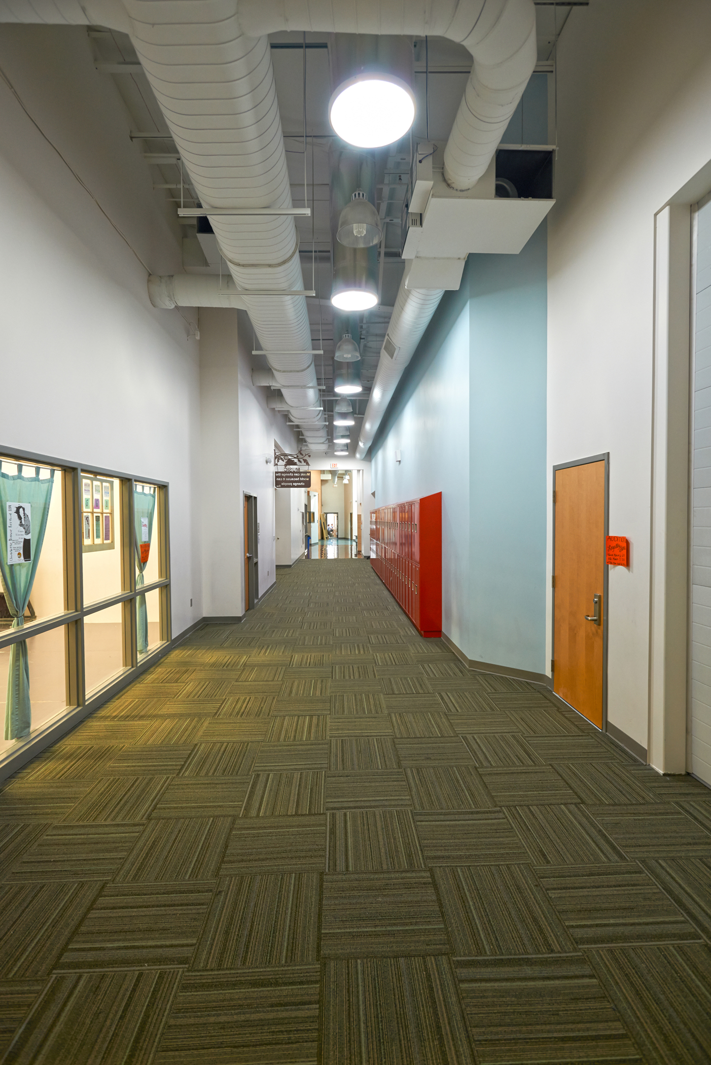 School hallway illuminated by VELUX commercial Sun Tunnels (tubular skylights) delivering natural daylight in Rhode Island