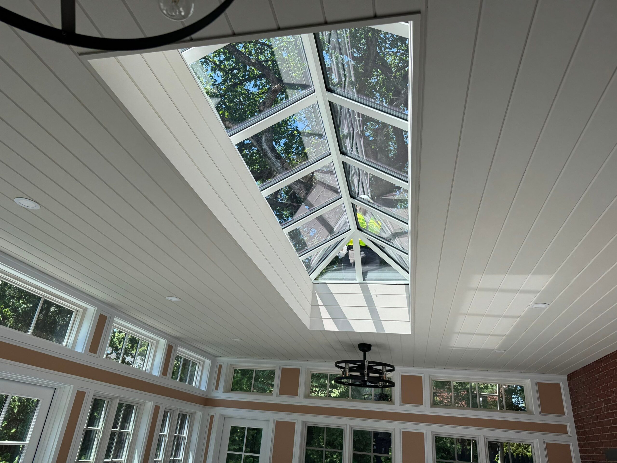 Interior angle view of a large VELUX metal-framed commercial skylight delivering uniform daylight in Rhode Island